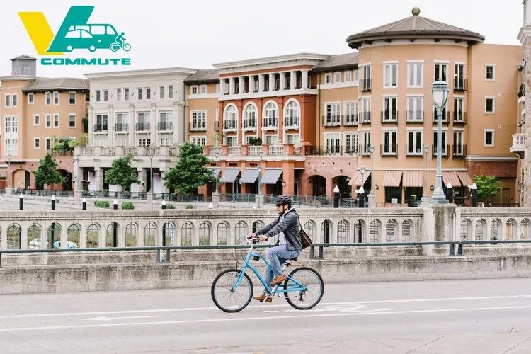 A bicyclist rides over the Third Street Bridge