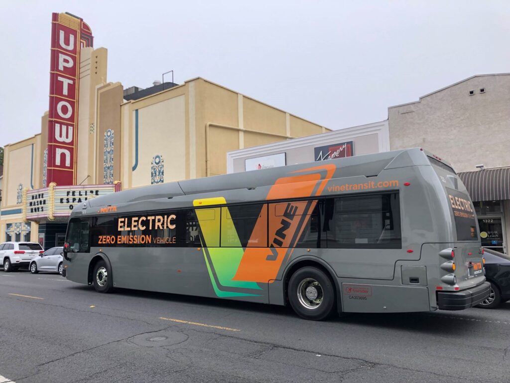 Napa Valley electric bus in front of the Uptown Theater